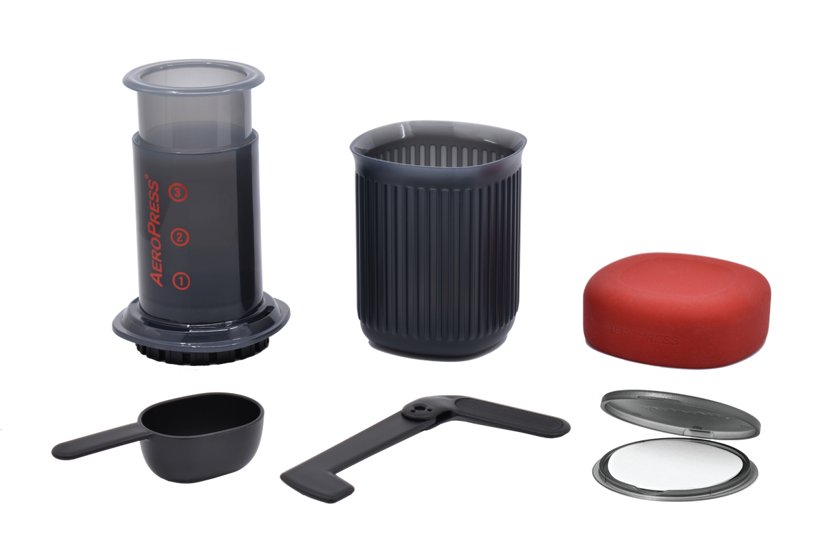 AeroPress Go with all included accessories laid out